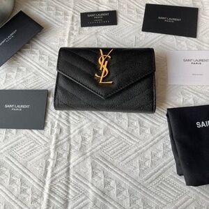 Yves Saint Laurent Black Wallet with Gold Emblem